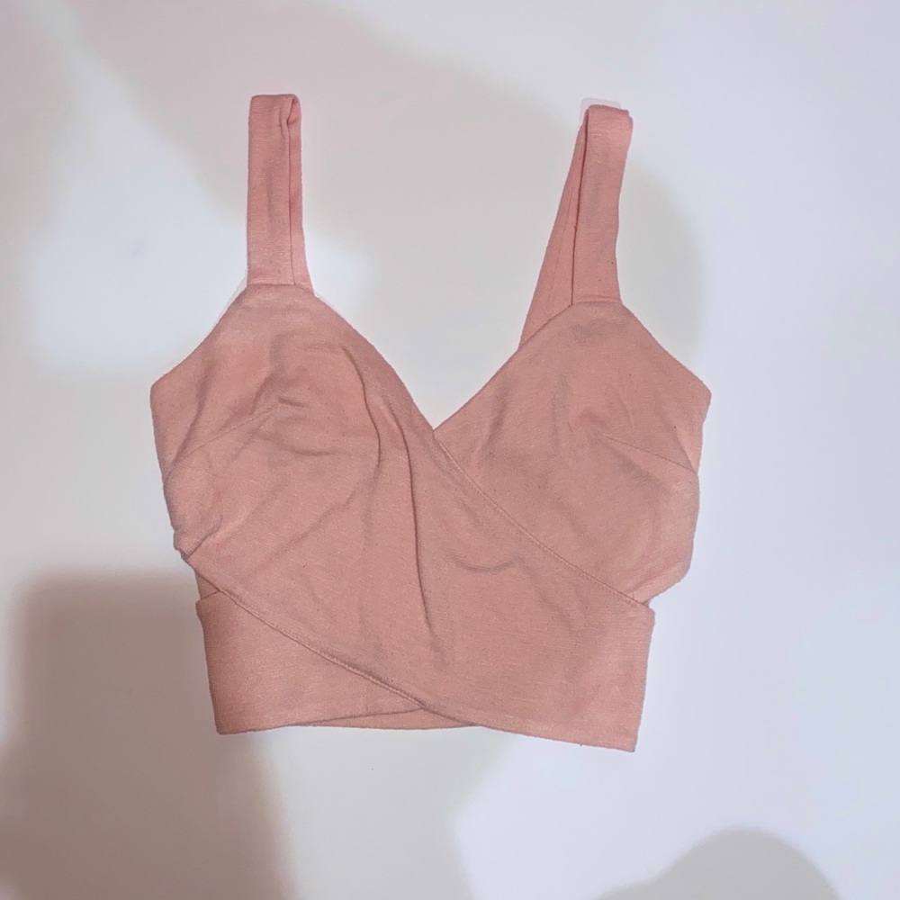 Cute light pink cross wrap crop top w/ side slits